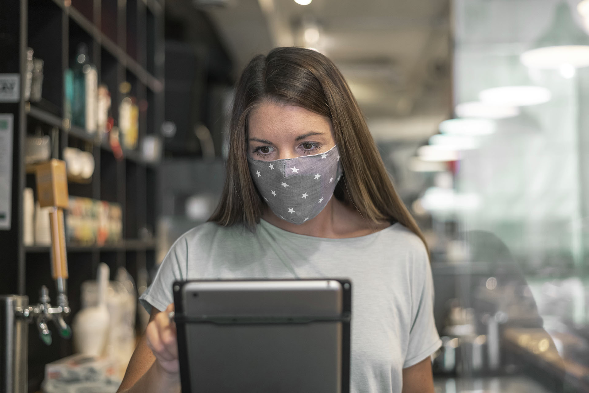 Restaurant owner ordering supplies from a tablet