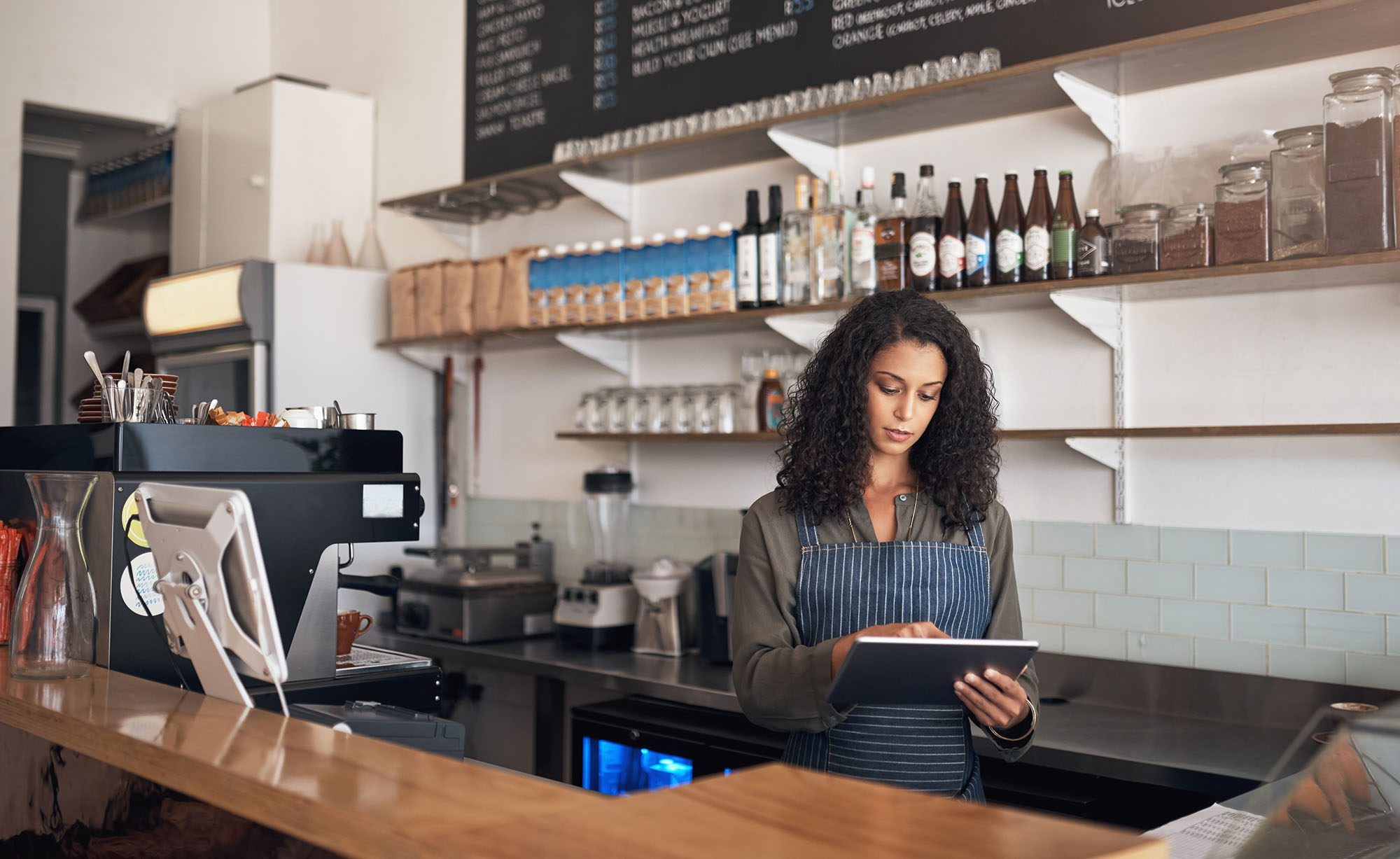 Restaurant owner ordering from a tablet