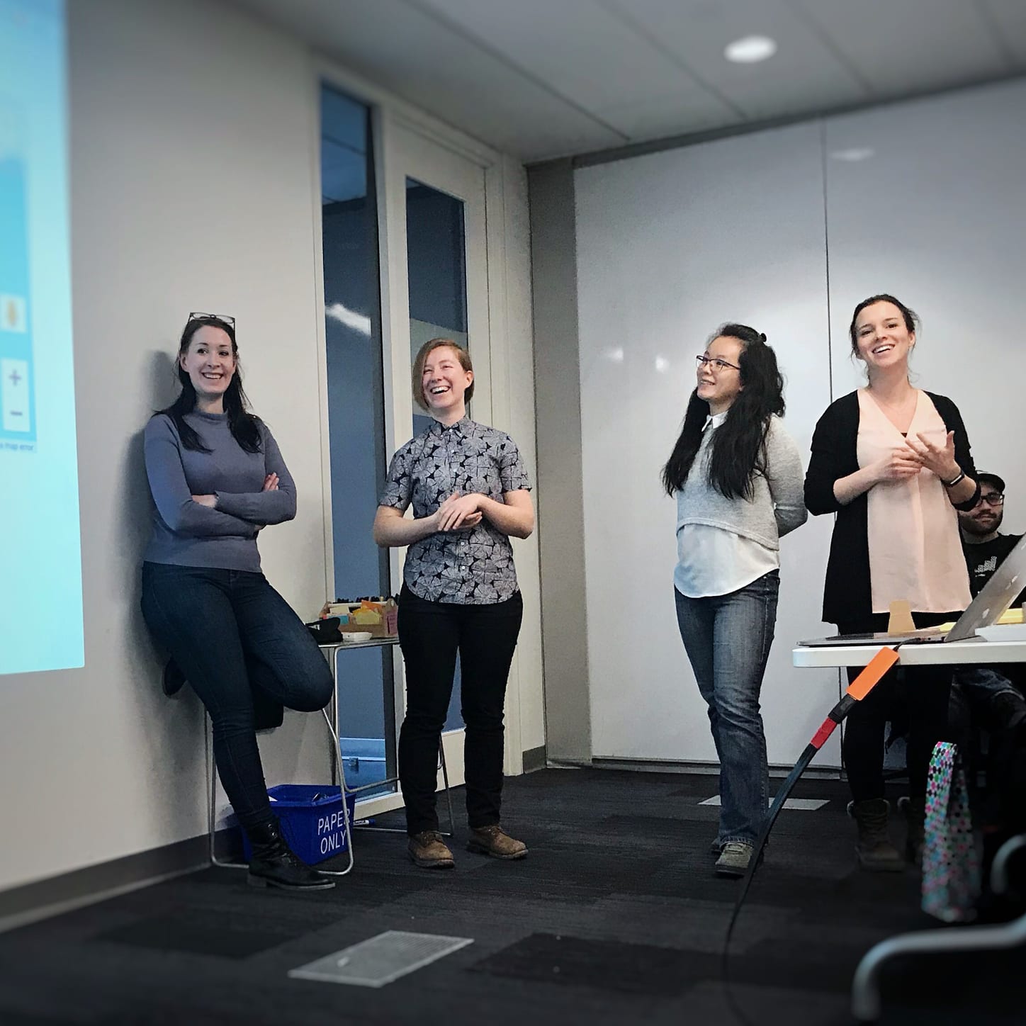 4 women in a conference room