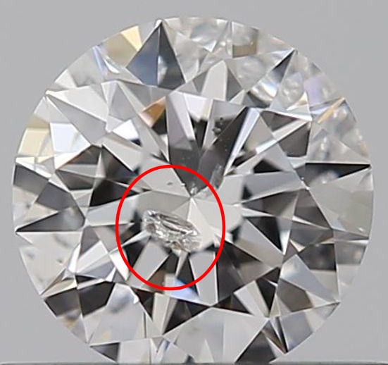 A round diamond against a gray background has a red circle around a large break in the diamond, called a feather