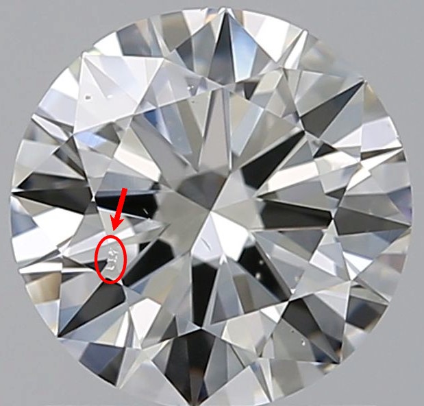 Round diamond against a gray background with a red circle and arrow pointing to zigzag diamond "etch channels"