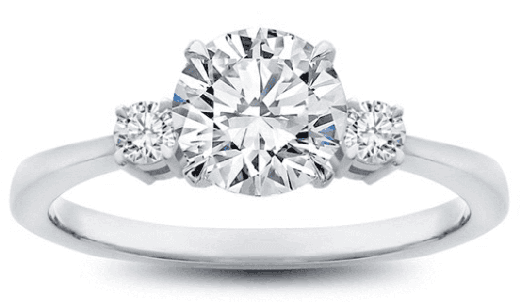 Round diamond in a three stone setting 