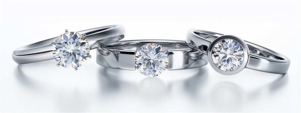 prong set, tension set and bezel set round solitaire diamond rings in white metal 