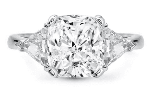 Cushion cut center stone with a trillion cut diamond flanking each side in white metal (3 stone)