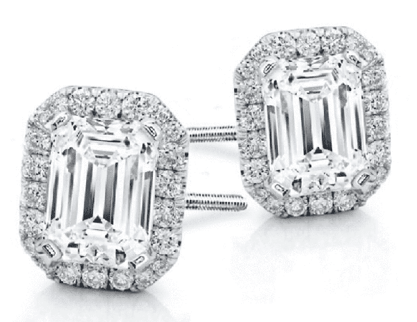 emerald cut studs surrounded by a round diamond halo 