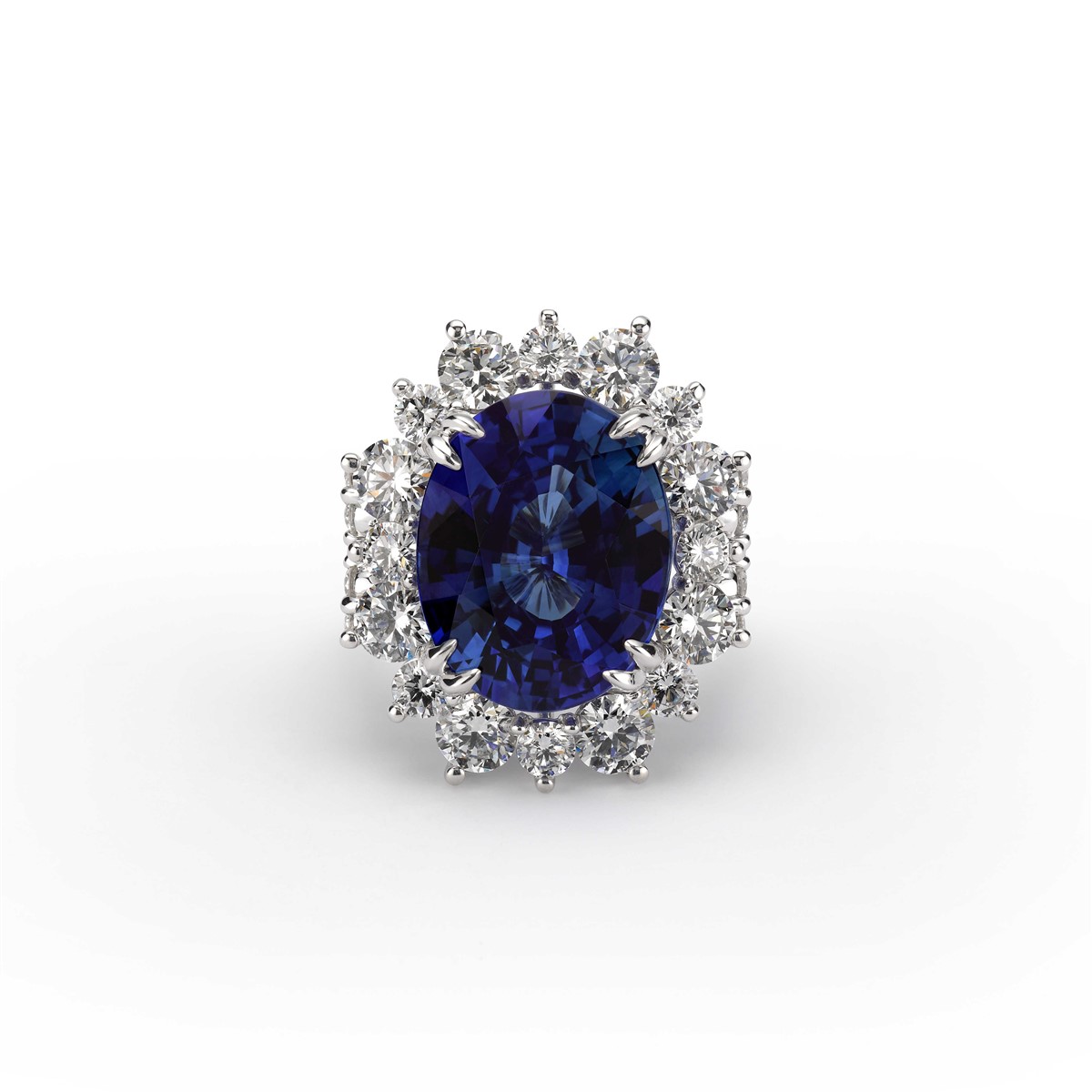 a blue oval sapphire center stone surrounded by a halo of diamonds 