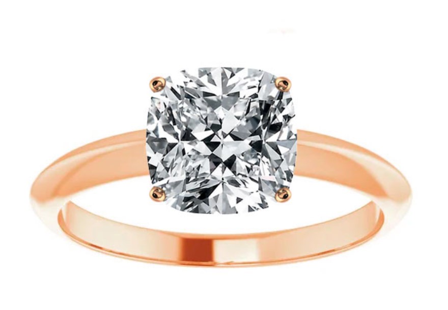 cushion cut diamond set in rose gold solitaire setting