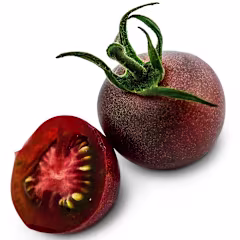 One whole and one sliced Black Cherry Tomato on a white background.