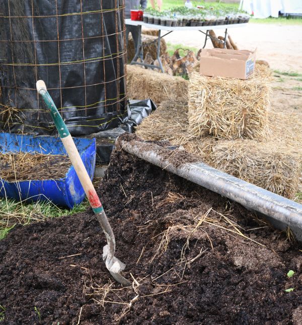 Compost pile with shovel