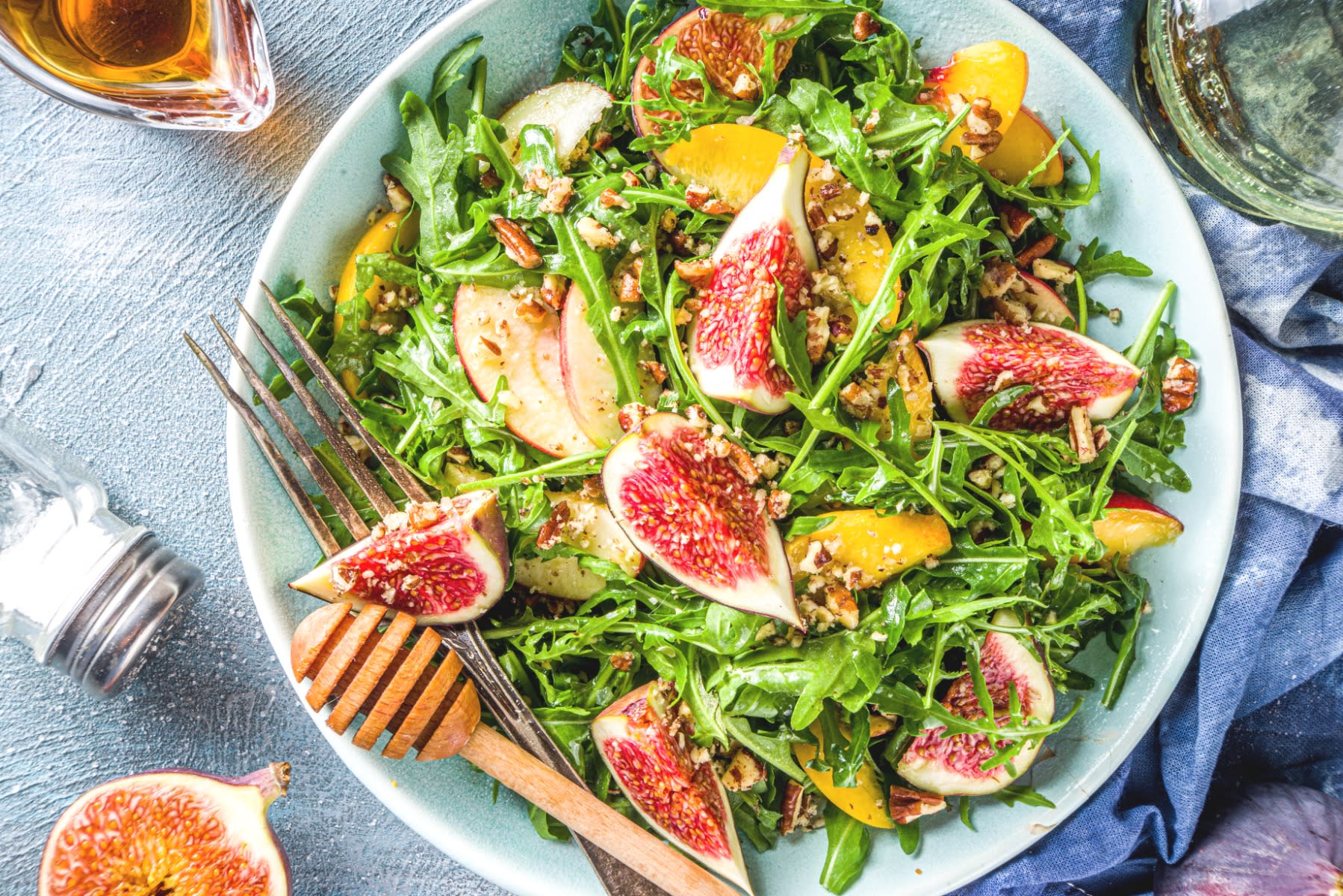 Arugula salad with peaches, walnuts, and figs