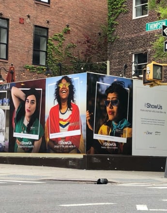 Show Us billboards on New York City street