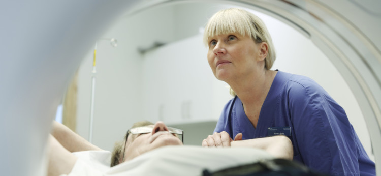 Patient and nurse during X-ray test.