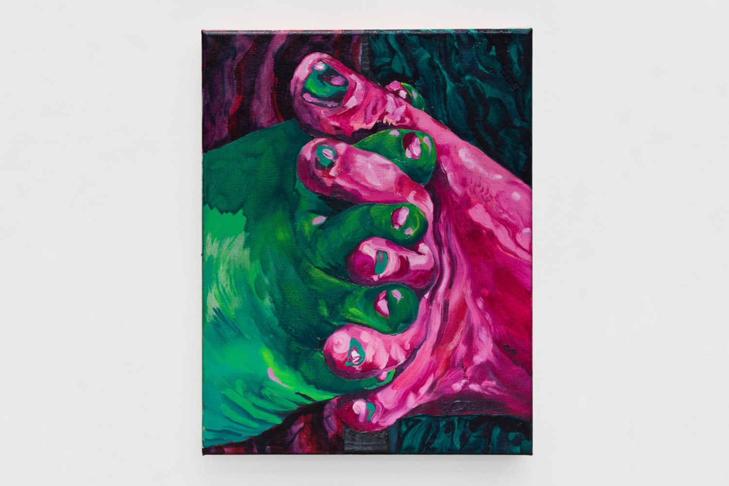 a green foot and a pink foot holding each other