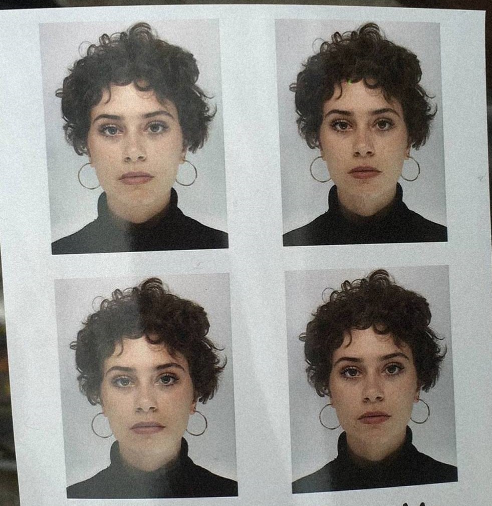 4 identical photobooth photos of a white non-binary person with short curly brown hair. 