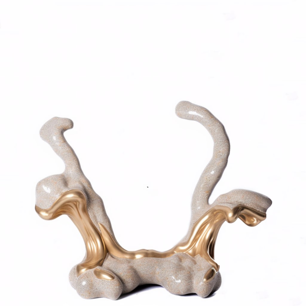 This image is a sculpture with a wavy shape and is predominantly gold and beige in color.  