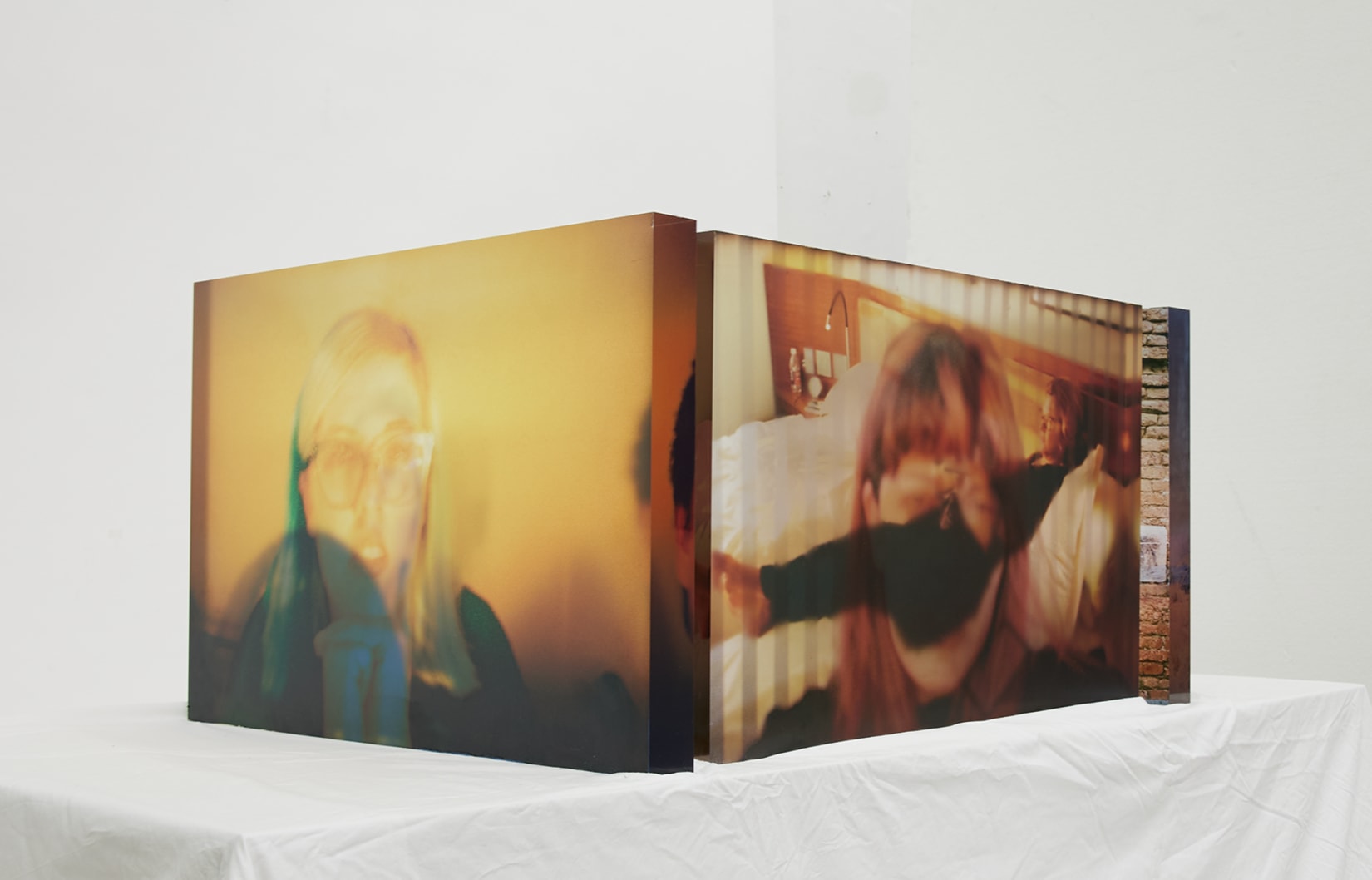 3 large slabs of acrylic with UV printed self portraits on one side and images of the artist's mother on the other. 