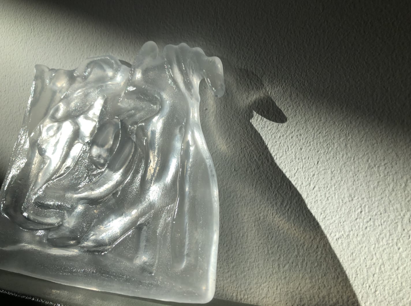 a zoomed in image of an individual glass piece with sunlight falling on it