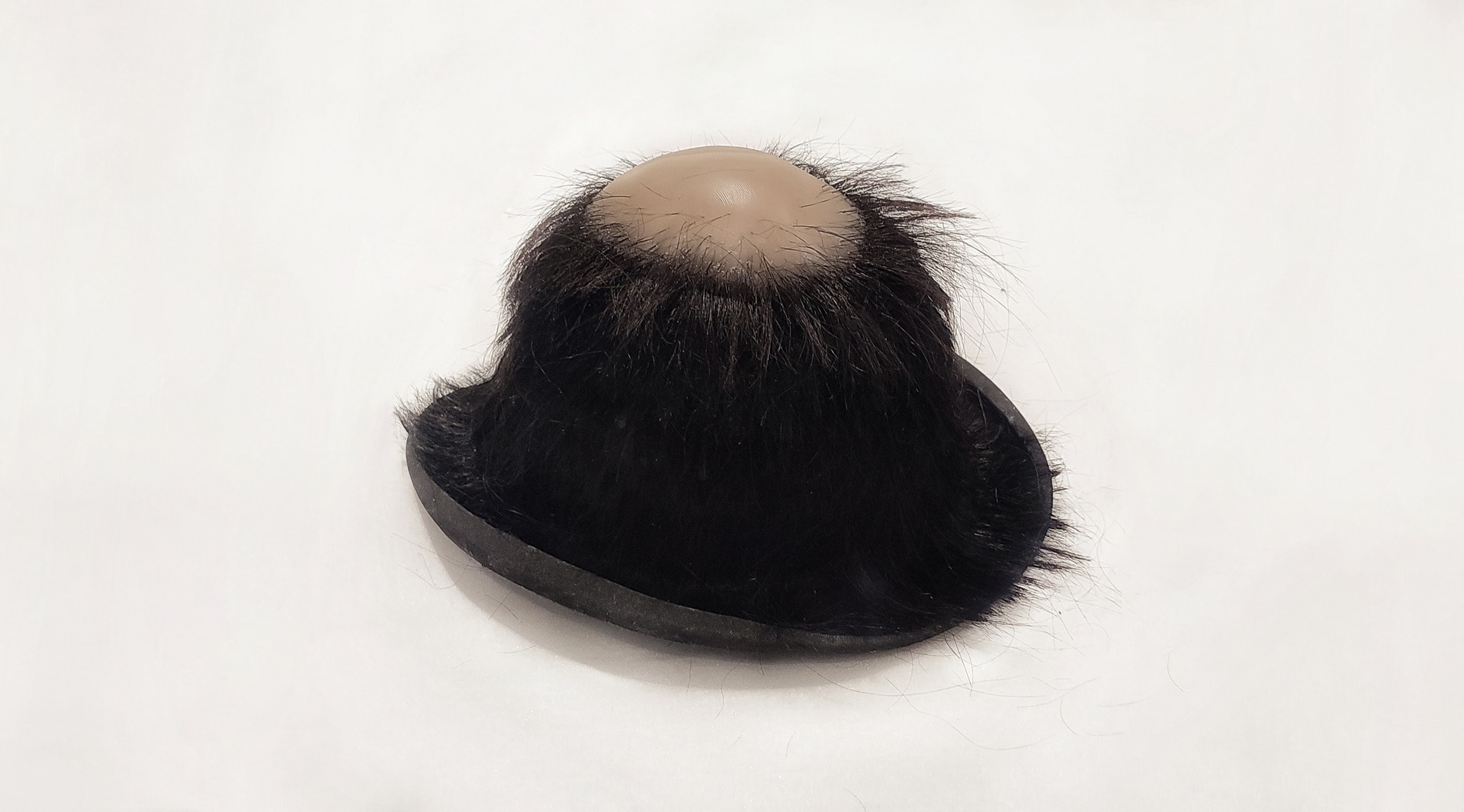 bald hat on table image 
