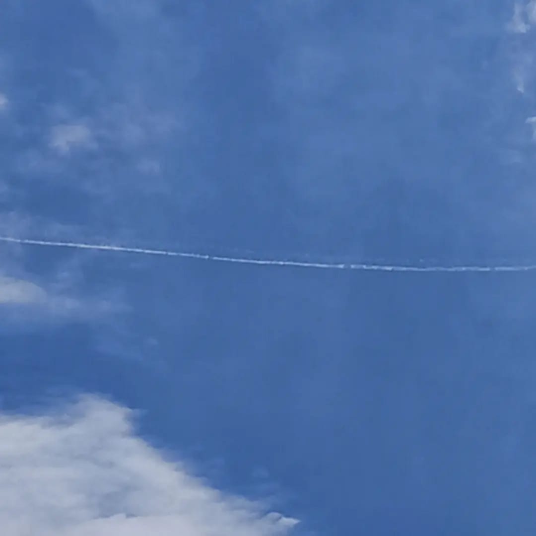 London's sky and trails left behind by an airplane on June 13th 13:12, 2023 
