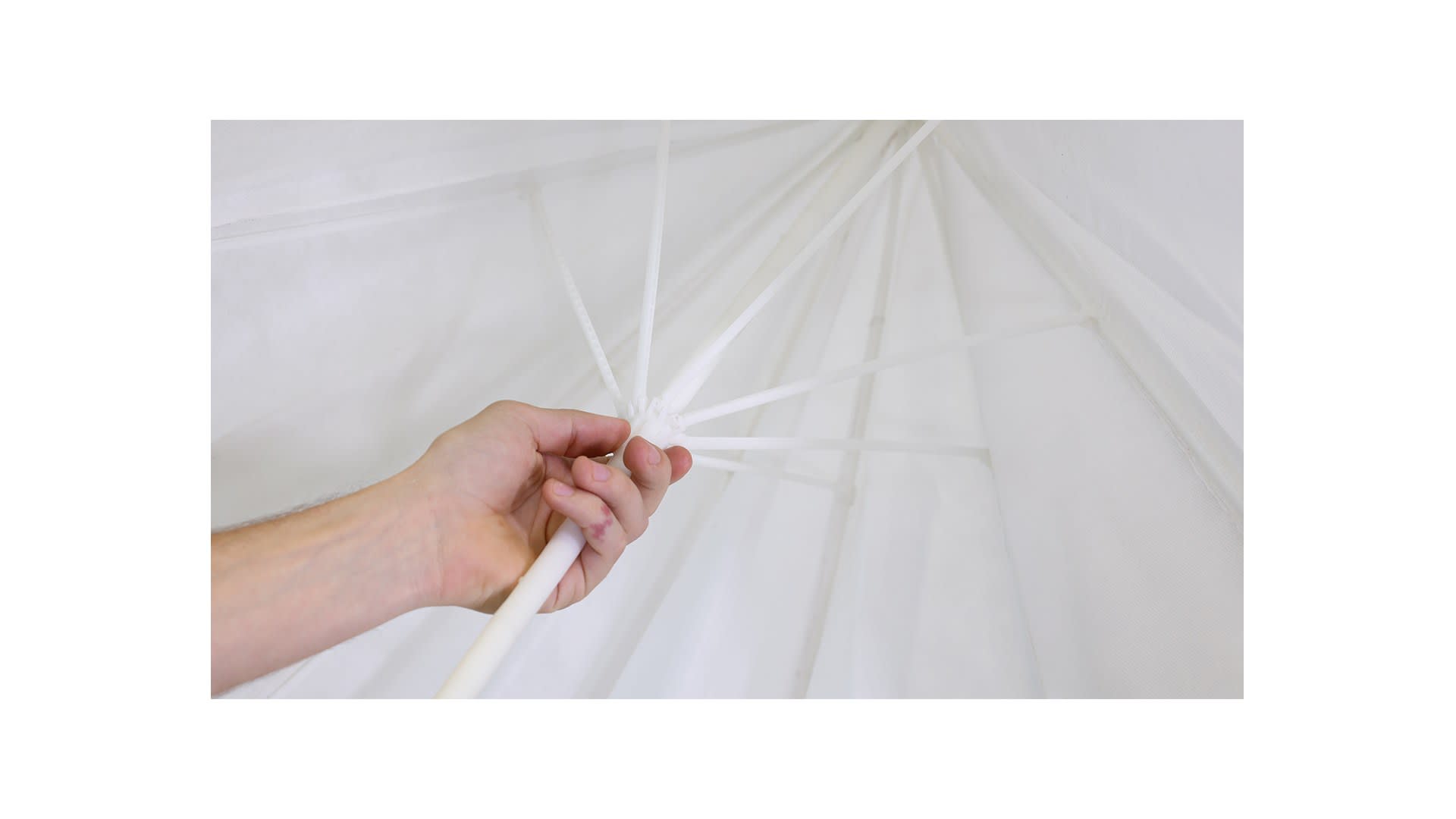 The working umbrella retains a purity & simplicity from using only undyed polymer throughout.