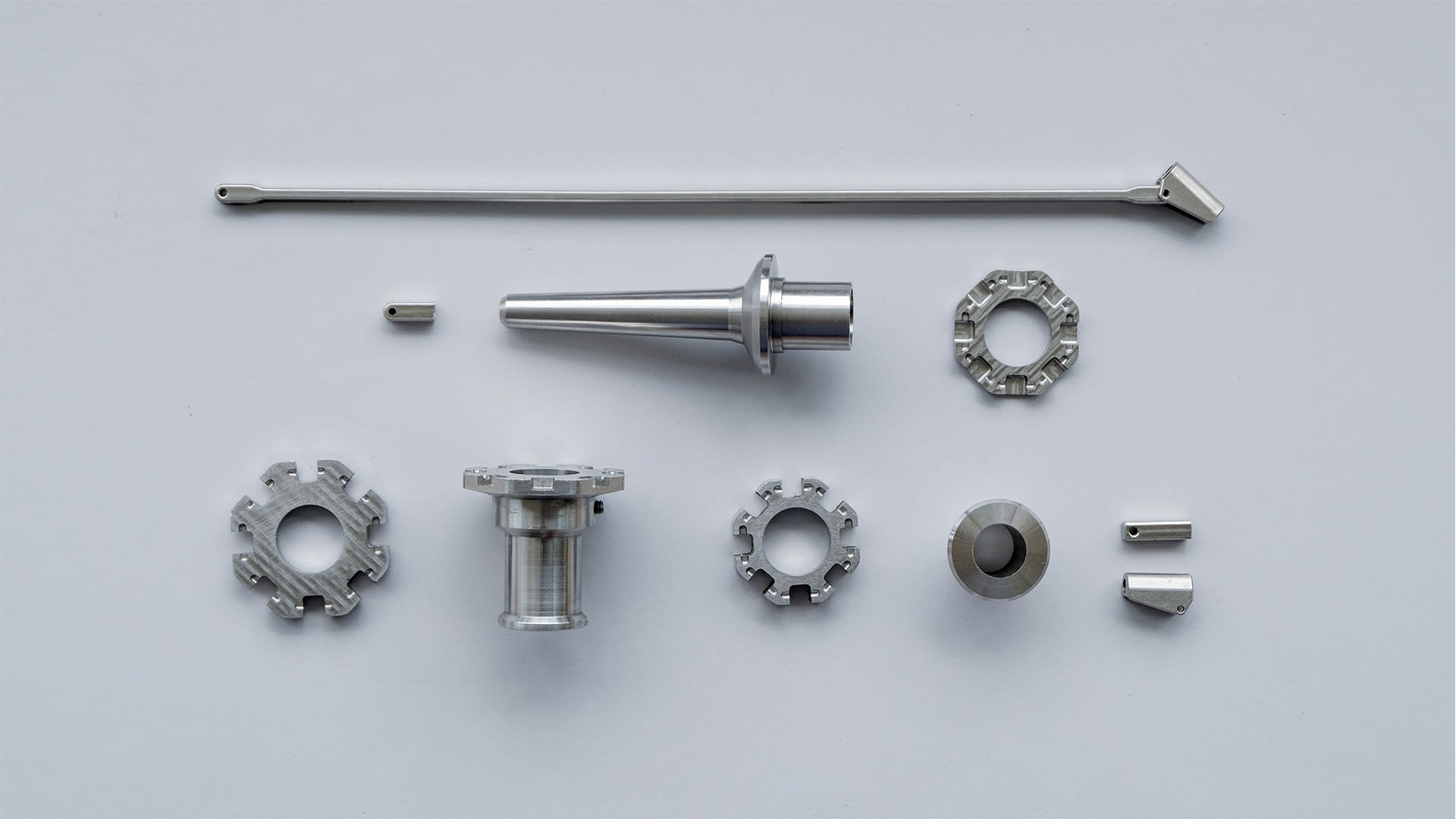 CNC milling was used to create the stainless steel parts.  Total weight of assembled umbrella: 1.71kg.