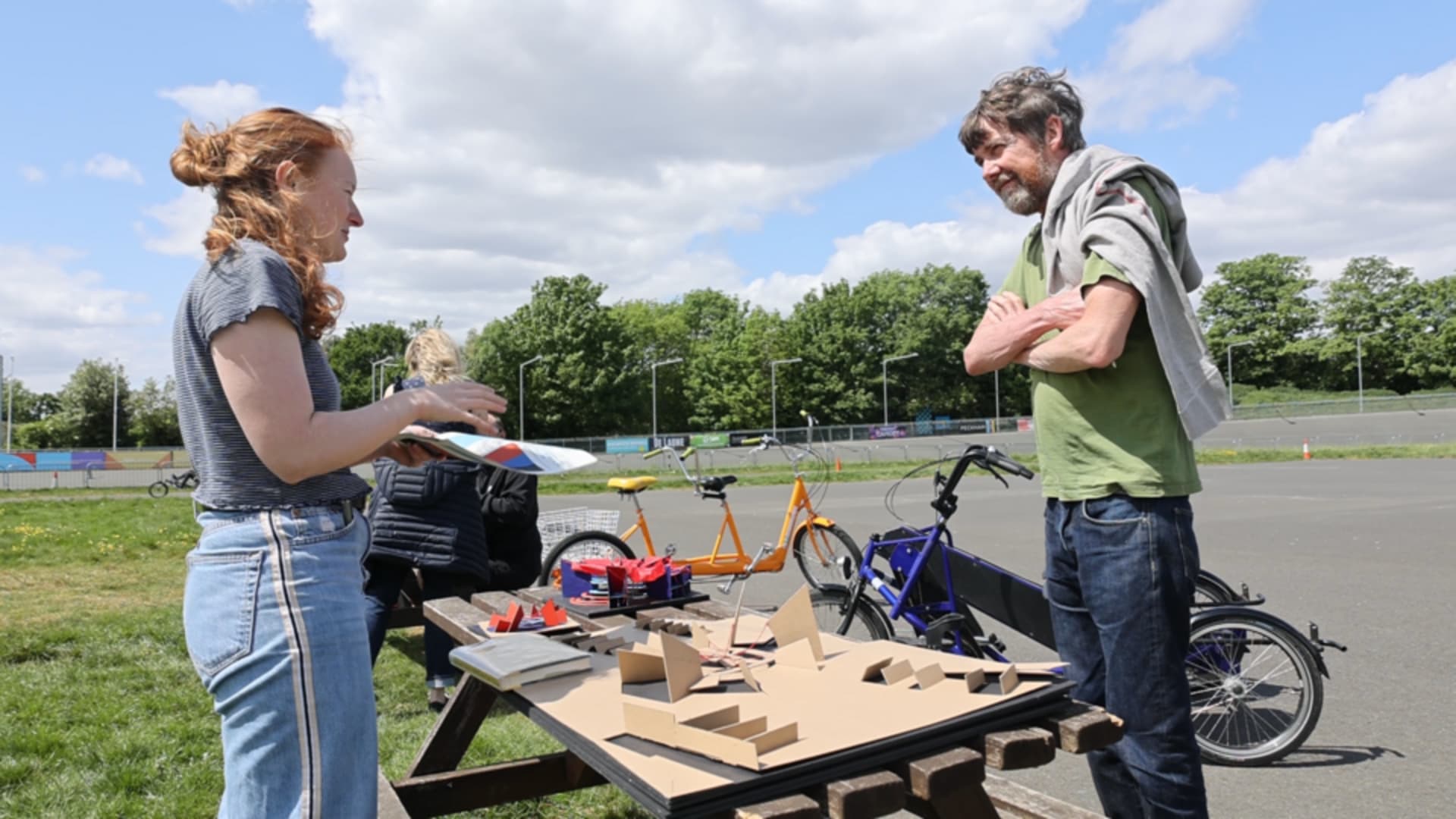 Emma talking to disabled cyclist about the project