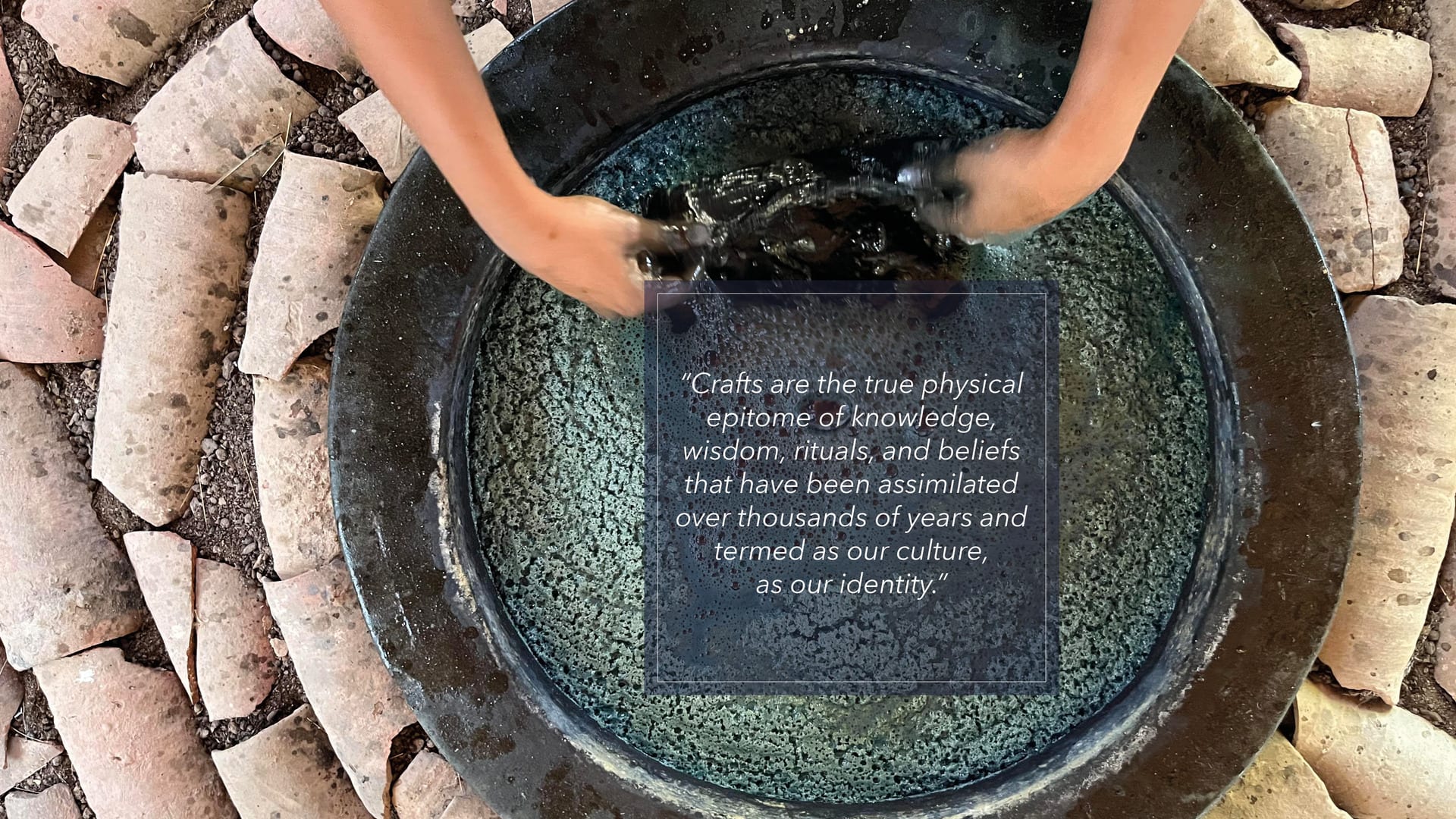 a person washing a bucket