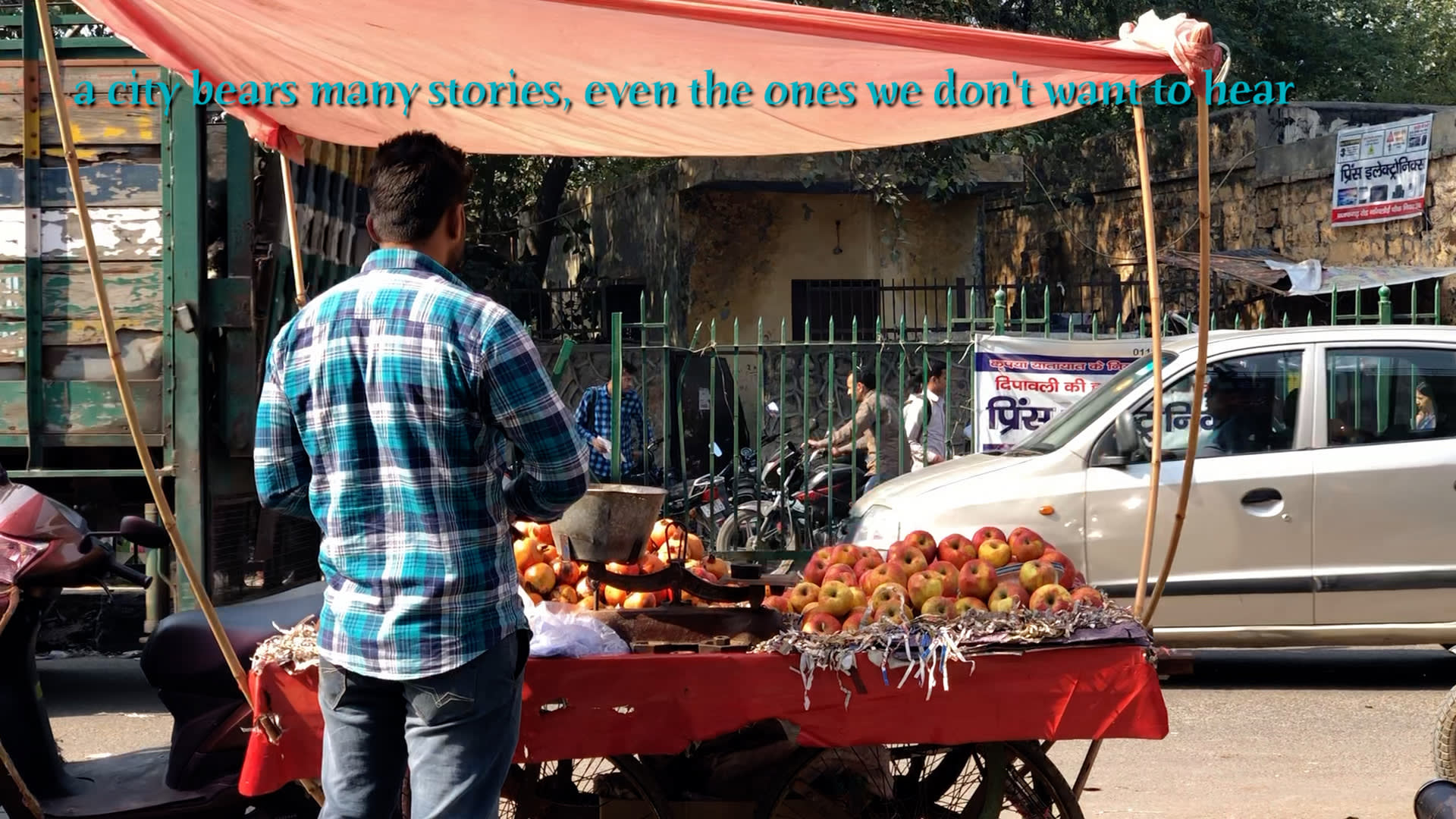 a person pushing a cart full of fruit