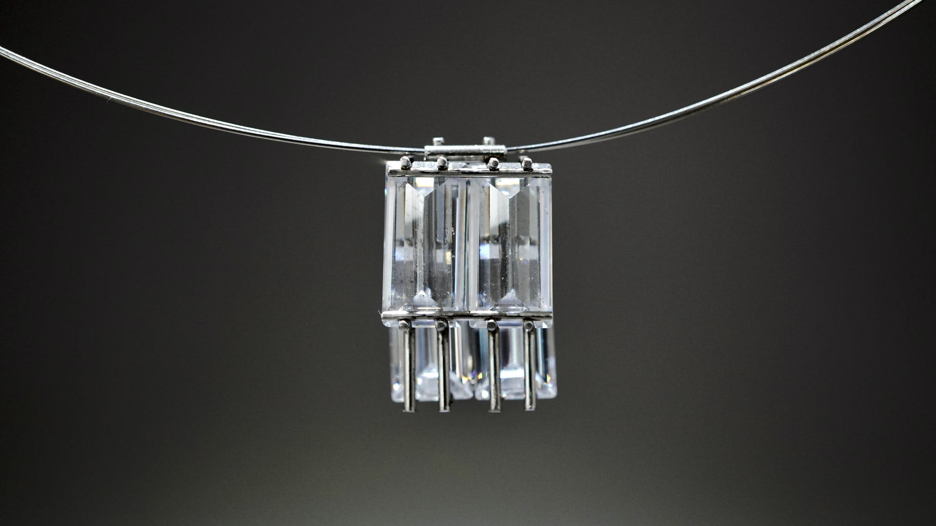 necklace inspired by windows. Utilise the transparent characteristics of white cz to overlap the stone in this setting.