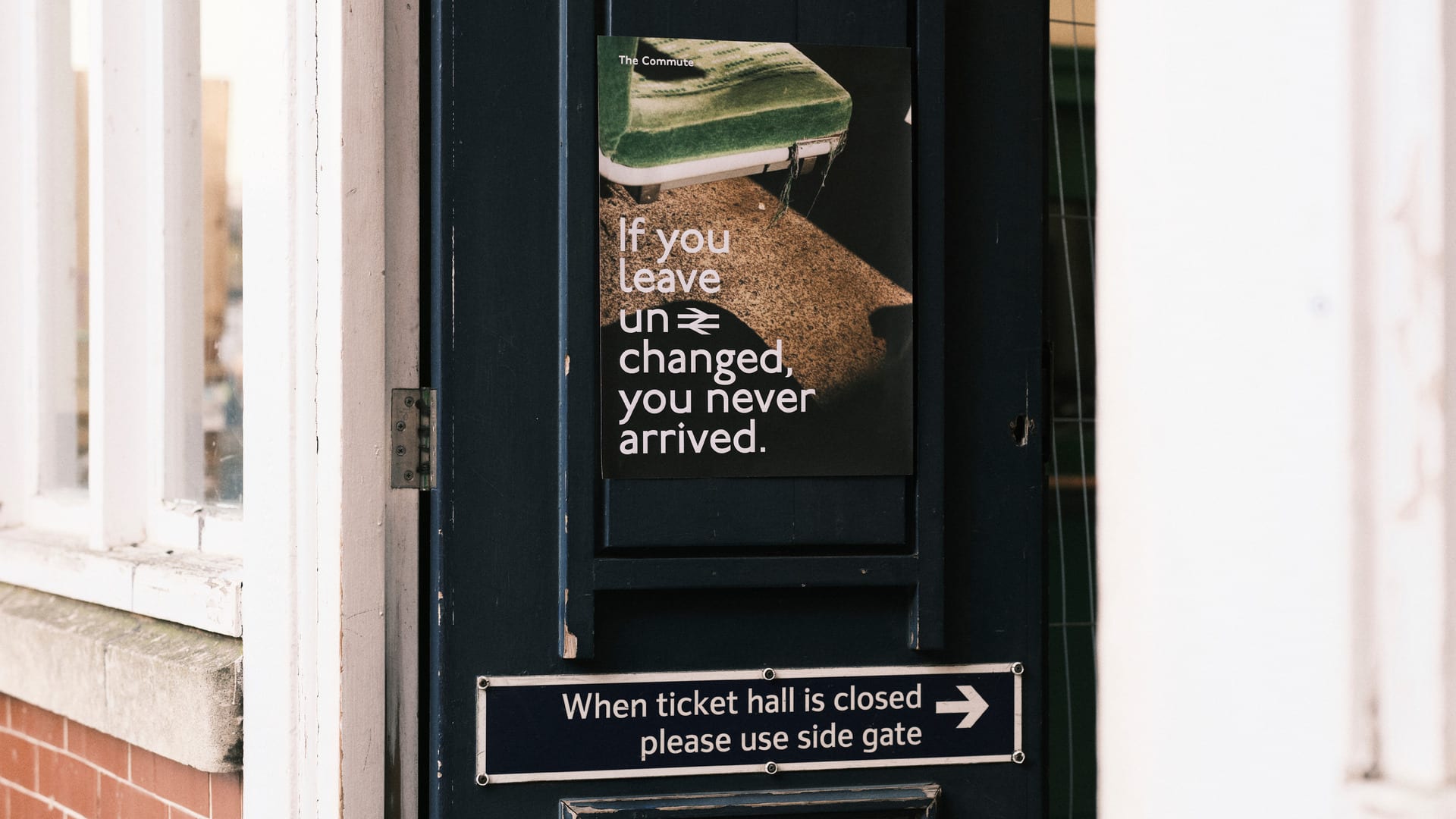 The station entrance, the poster is placed on the door and reads ‘If you leave unchanged, you never arrived’.