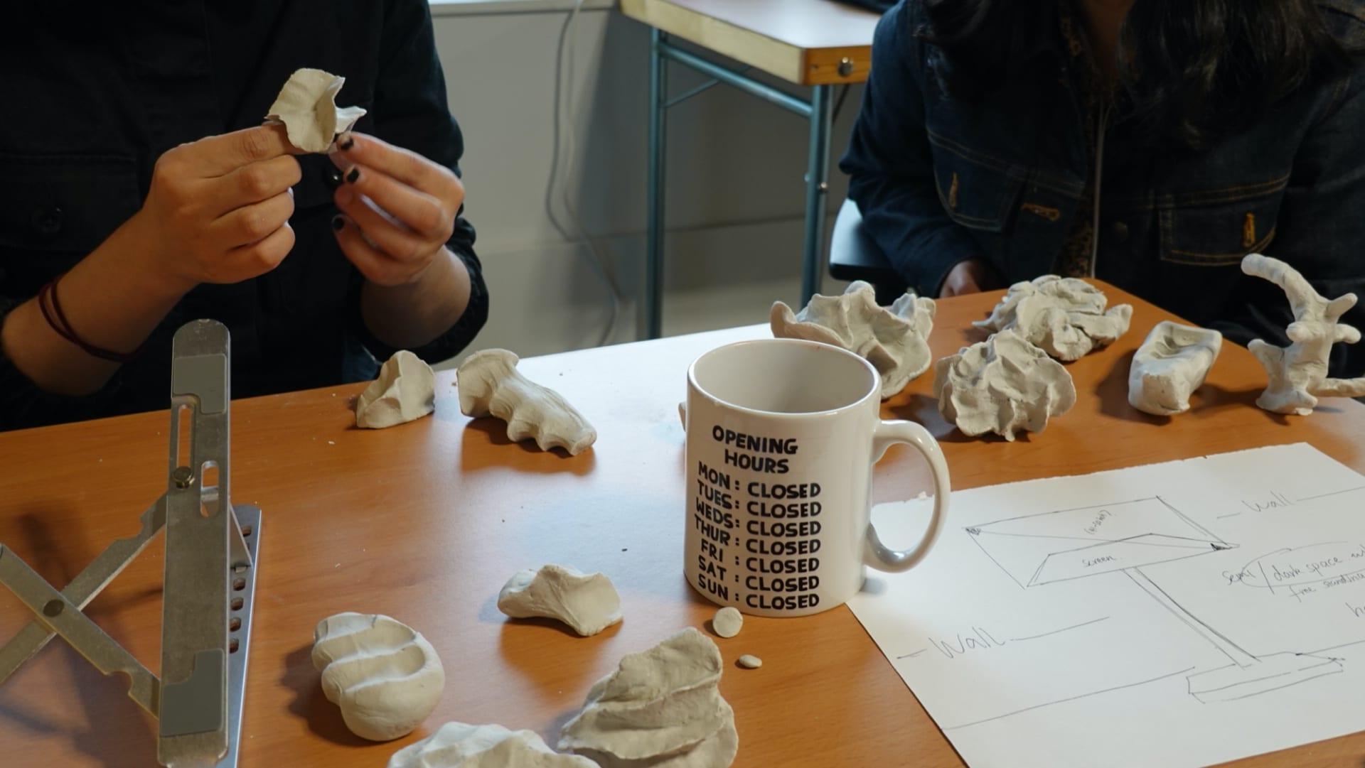 Girls making clay together.