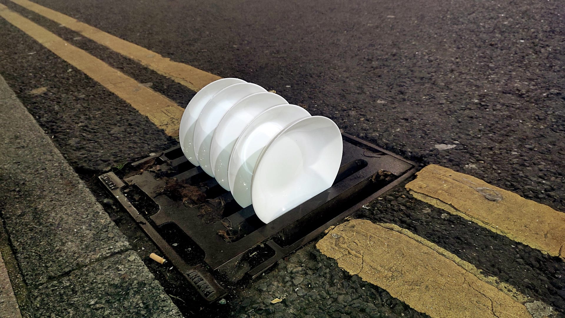 Plates placed on the water drainage on the street 