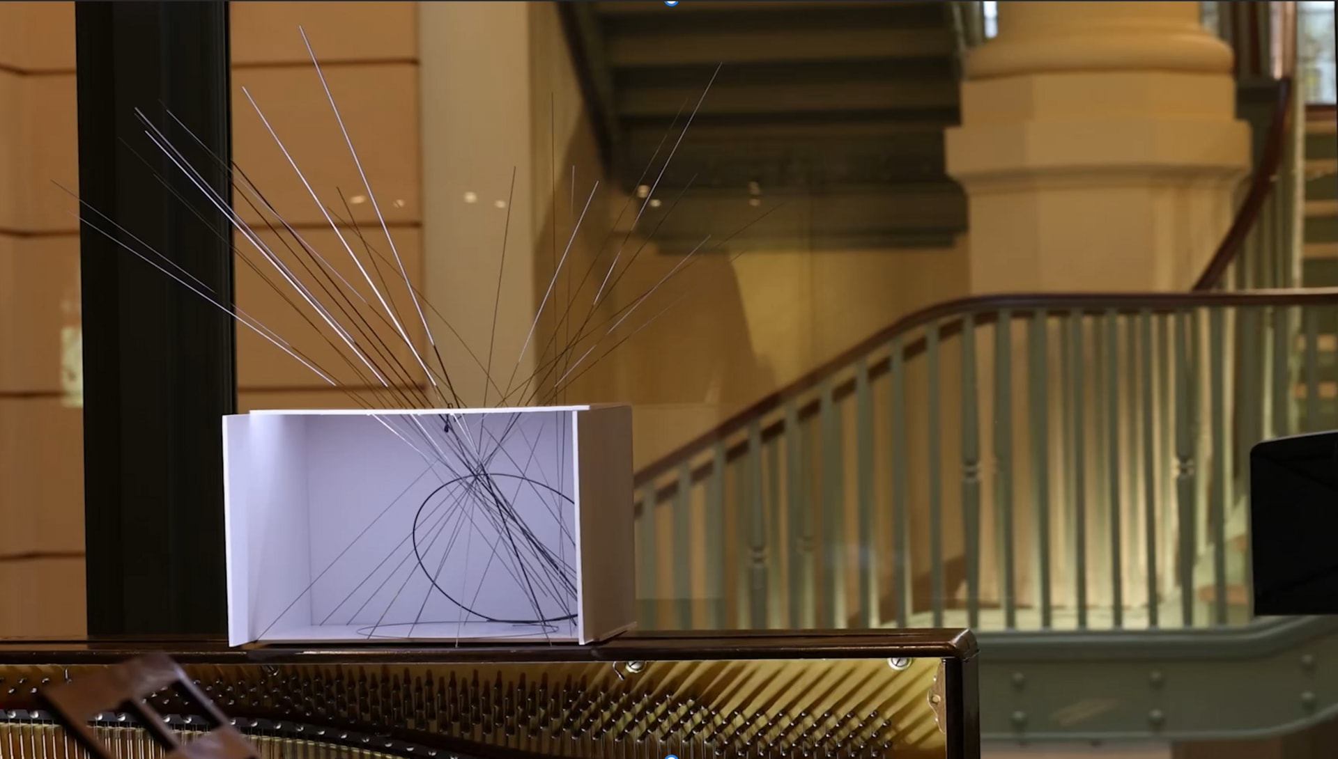 close up of a piano wire sound sculpture installation