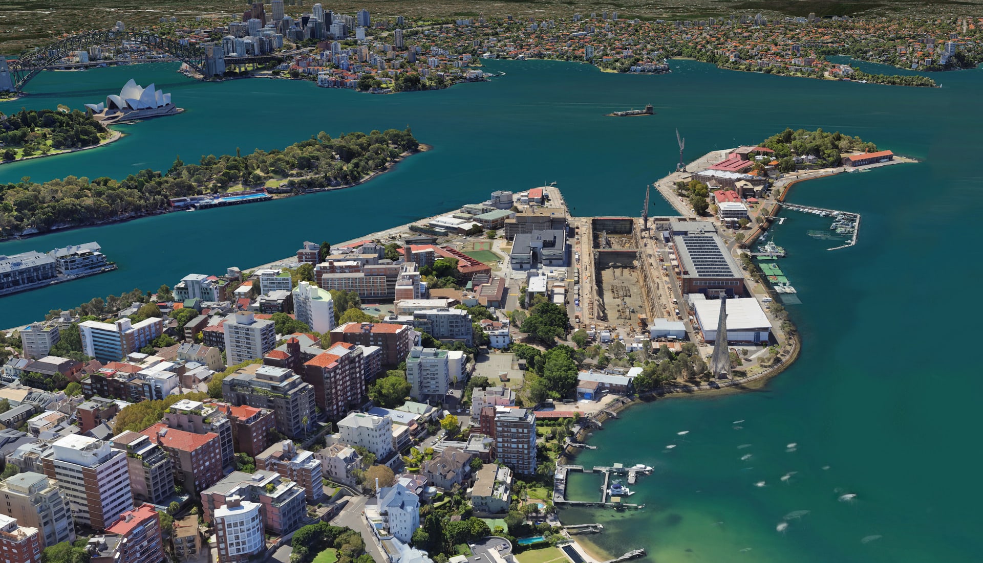 Birds-eye view of Gadigal Land (Sydney Harbour) showing Garden Island in its present condition as a military base.