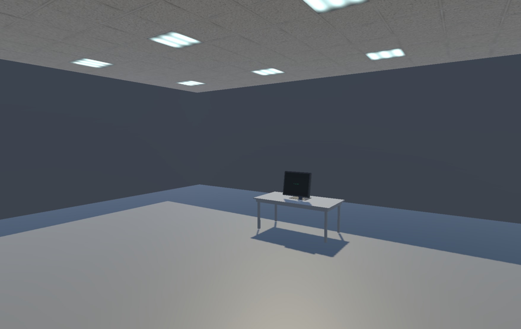 A bland, grey office space with one computer sitting on a desk and glaring office lights shining from the ceiling.