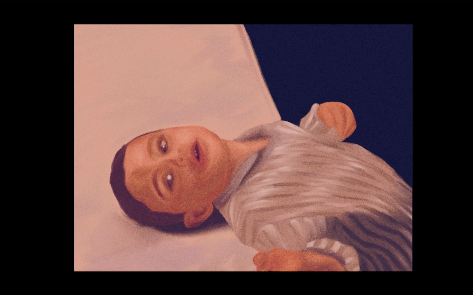 Still 1: Child lying in bed.