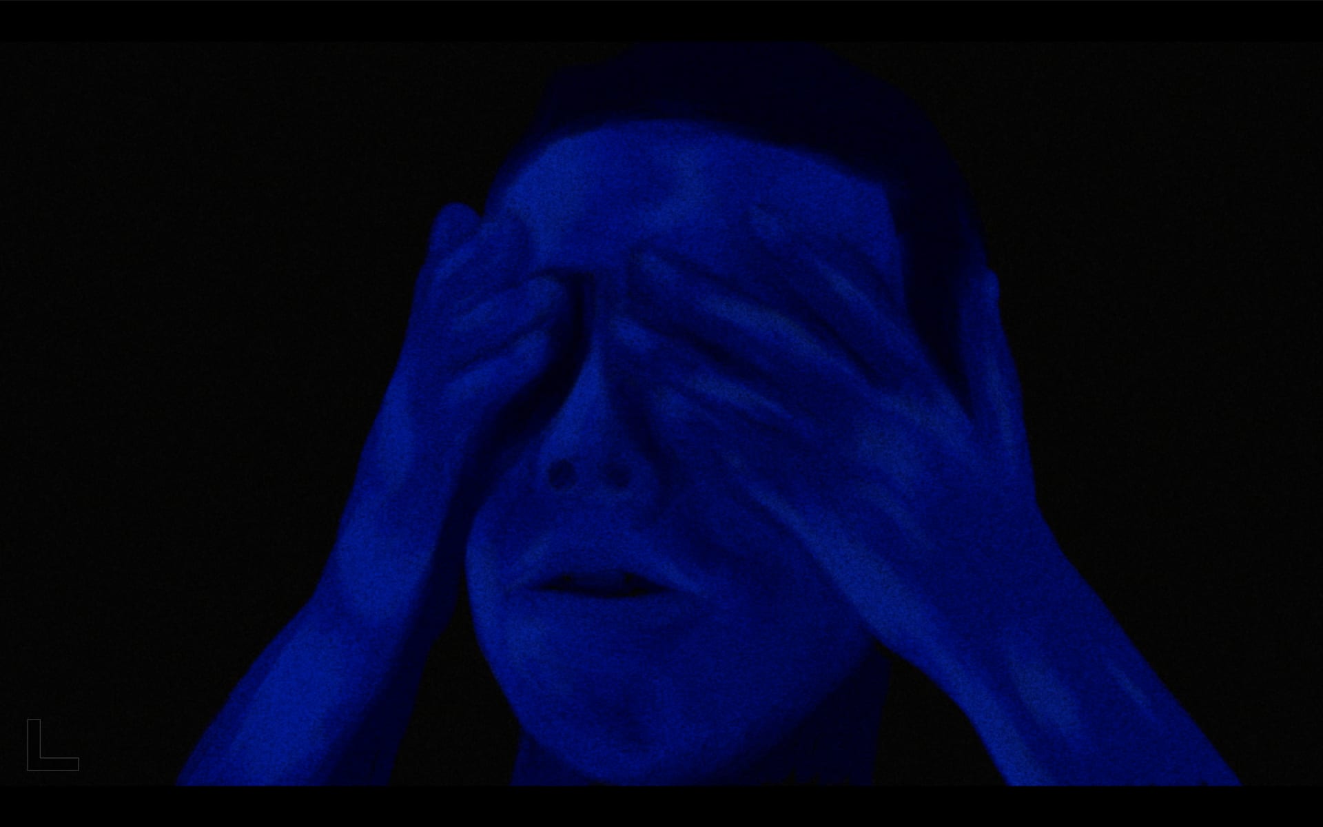 Still 4: Man eyes covered with hands. 