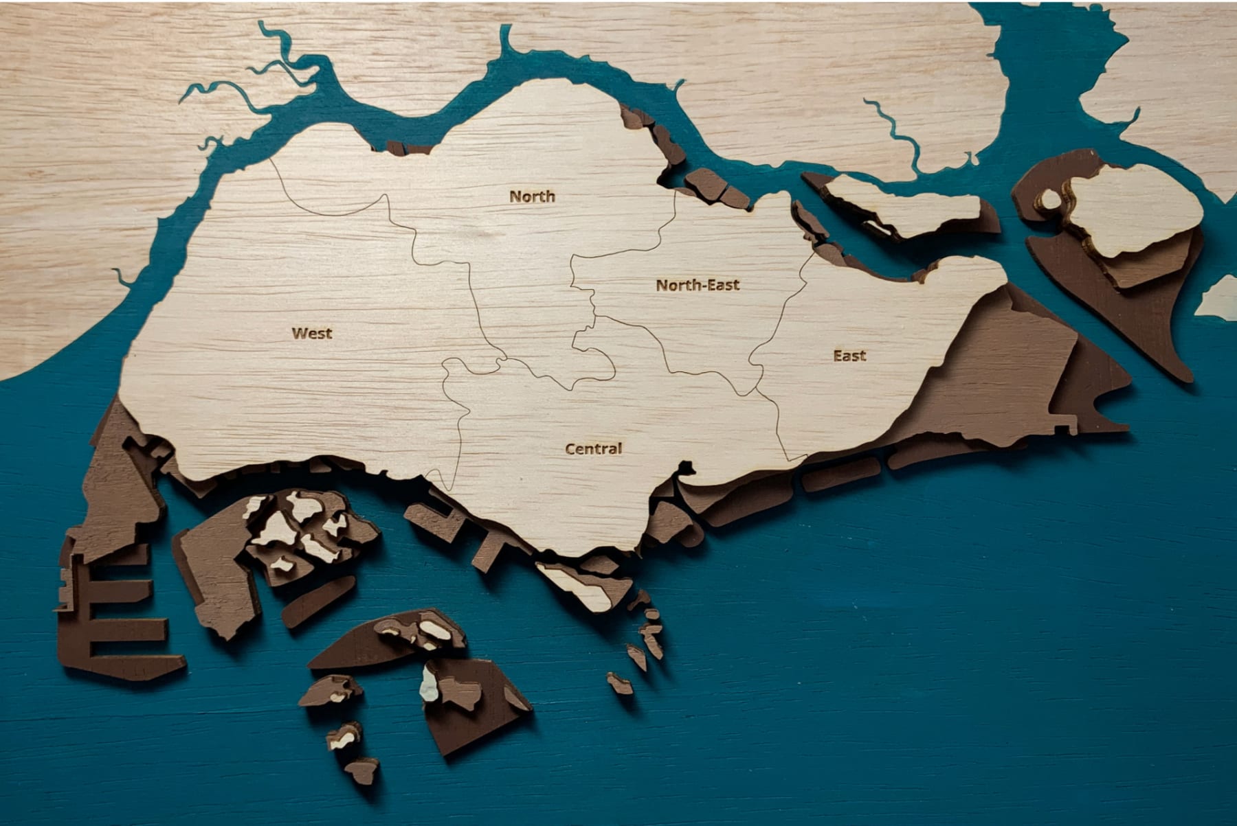 A map of Singapore showing its reclaimed land history in 3 layers (past, present, and planned future) in different colors