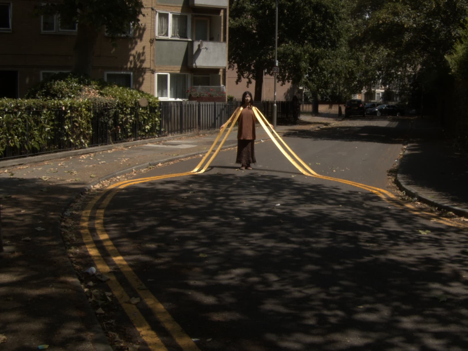 Yellow road mark necklace on road 