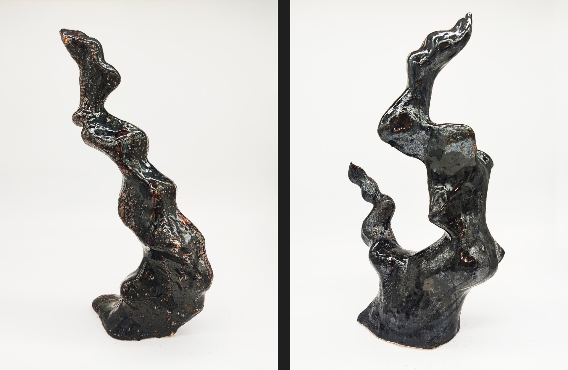 Two black sculptures have gold and silver texture 