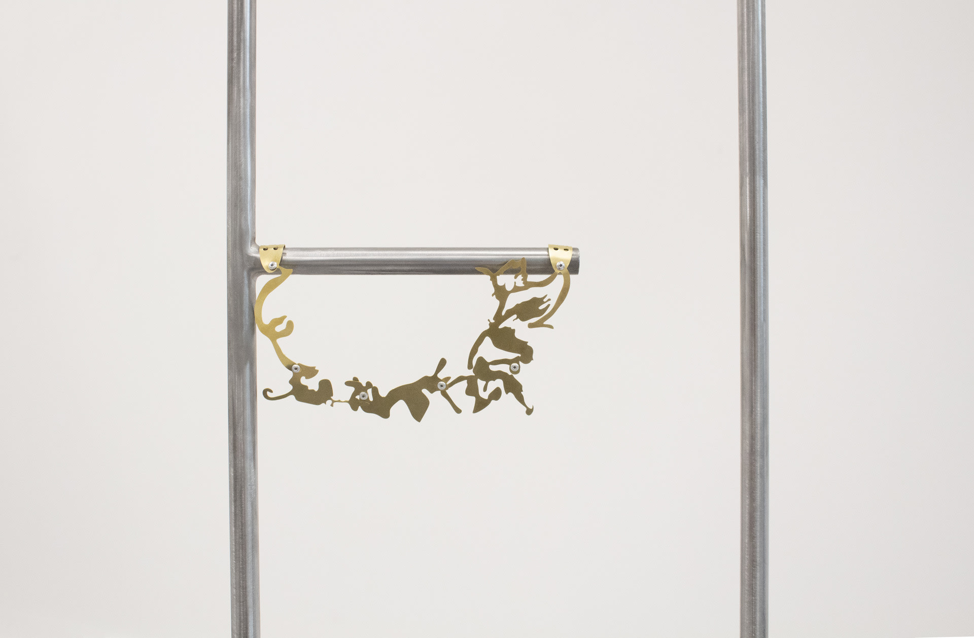 detail of hanging floral brass pendant  