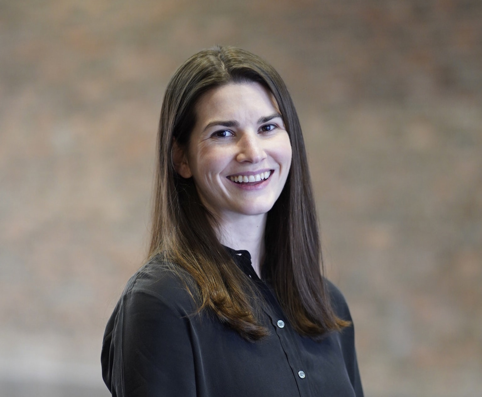 A photo of the designer, Liana O'Cleirigh, smiling to camera.