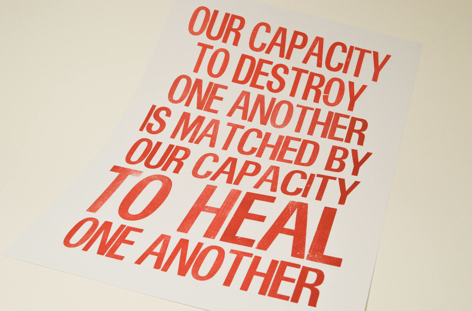 Poster that reads "Our capacity to destroy one another is matched by our capacity to heal one another"