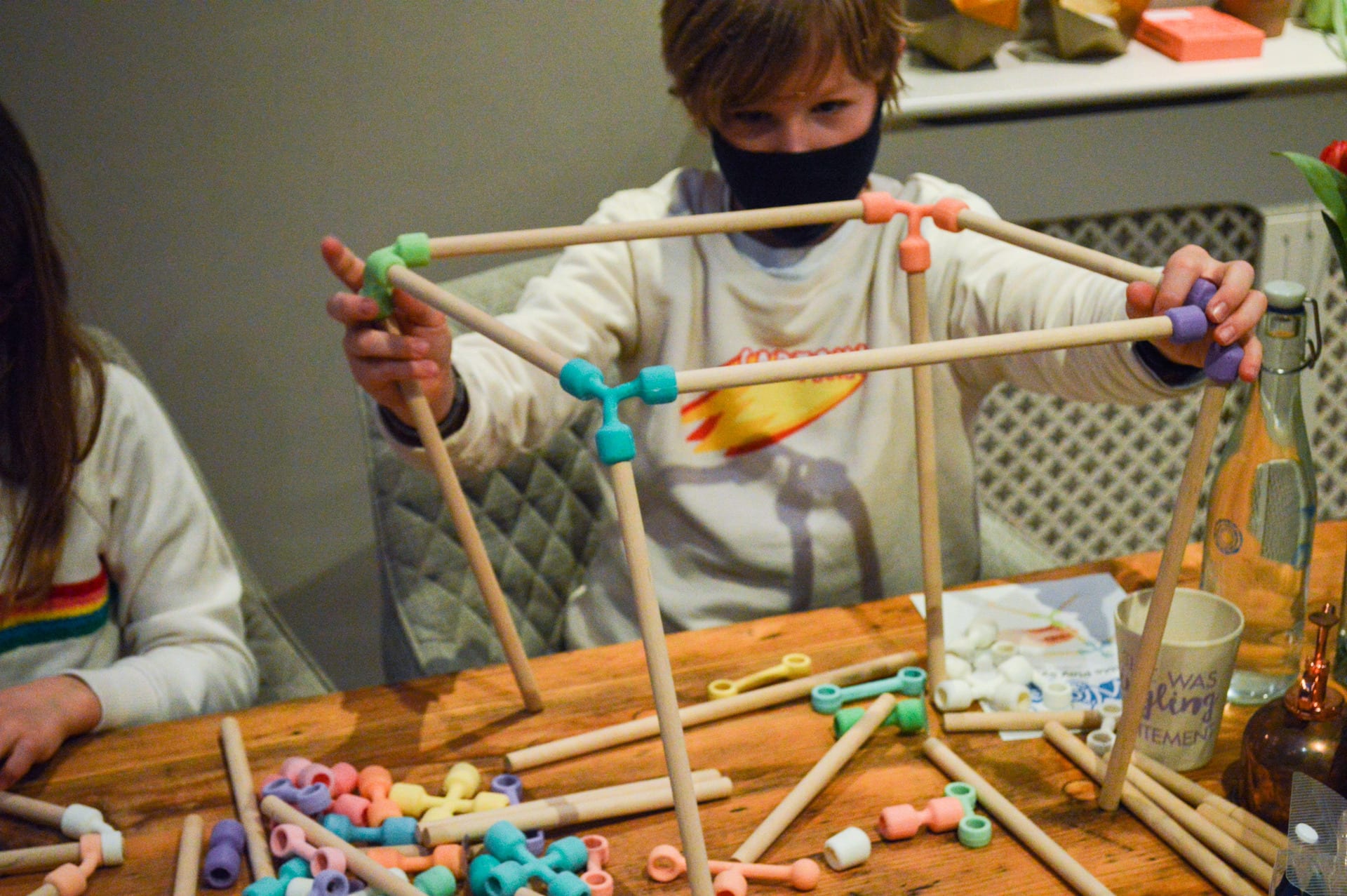 A boy constructing a box.