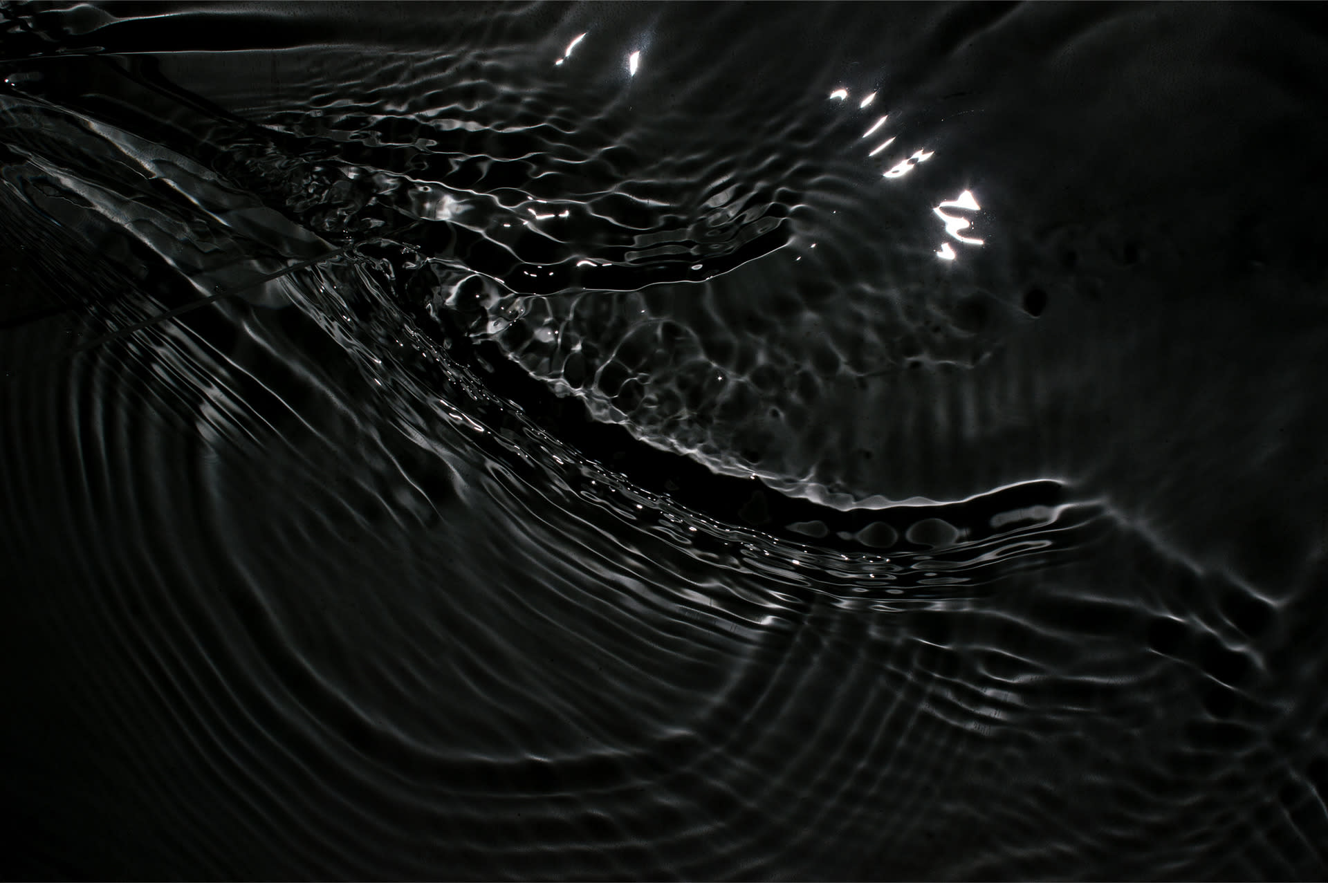 Black and white photograph of water ripples