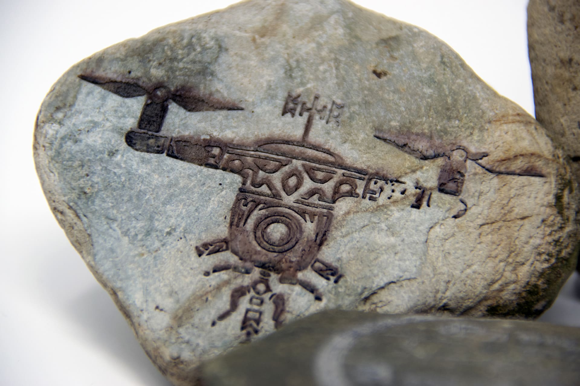 A stone with a Viking style drone etched on it. 