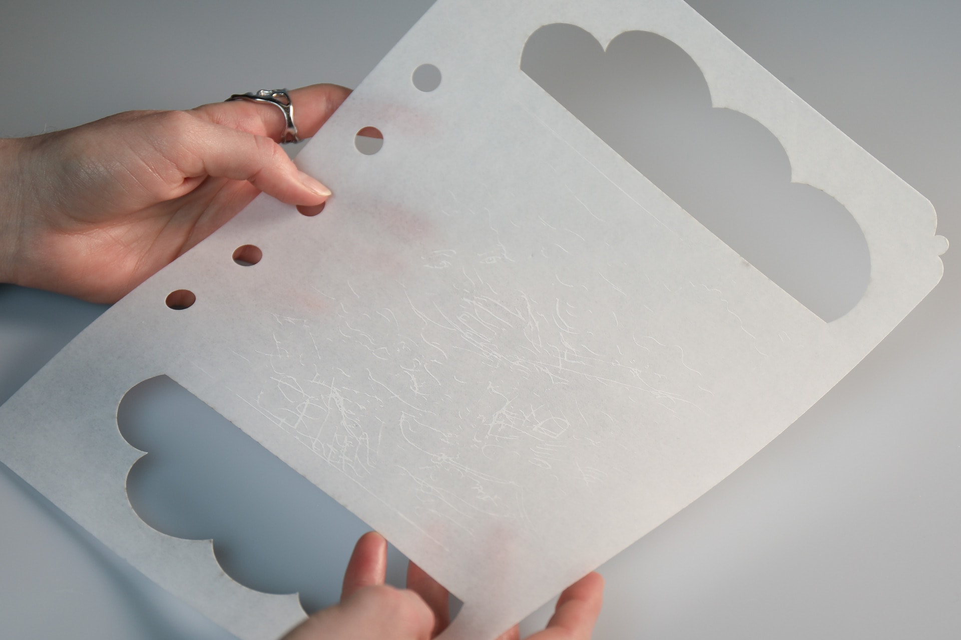 Cloud shape cut out from page of edible book using laser cutter