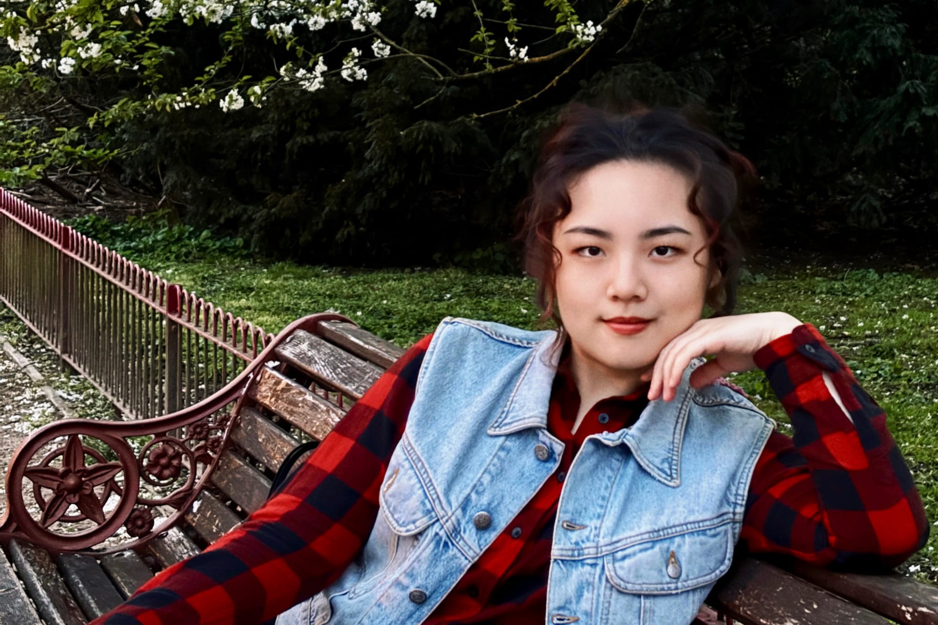 Me sitting on a bench in Battersea Park after school.