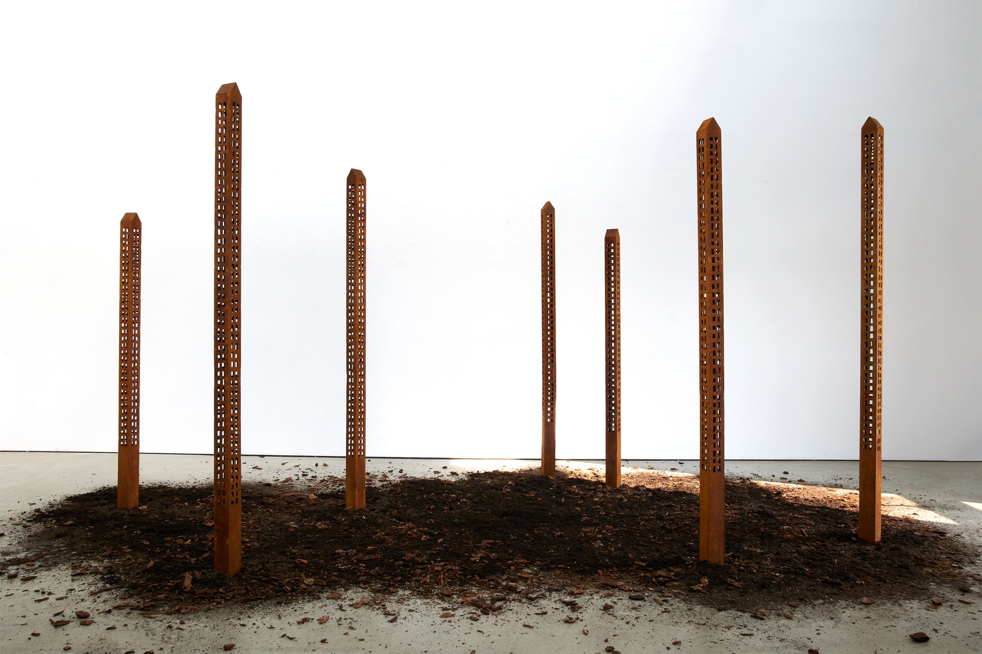 seven towering skyscrapers that rise out of scattered earth
