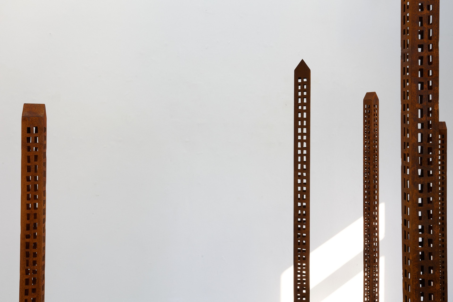 seven towering skyscrapers that rise out of scattered earth